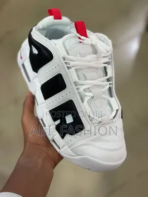Nike Air More Uptempo Low Sneaker in the White Photon Dust" Colorway.
