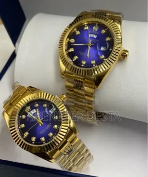 Gold-Toned Rolex Watches With Blue Dials and Diamond Hour Markers