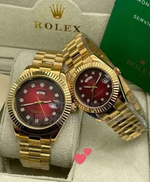 Gold-Toned Rolex Day-Date Style Watches With Red Dials and Diamond Hou