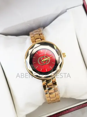 Gold-Tone Watch With a Red Dial and Faceted Crystal, Possibly a Gucci
