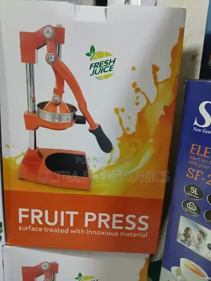 Manual Citrus Juicer Featuring a Lever Pressing Fruits Like Oranges,