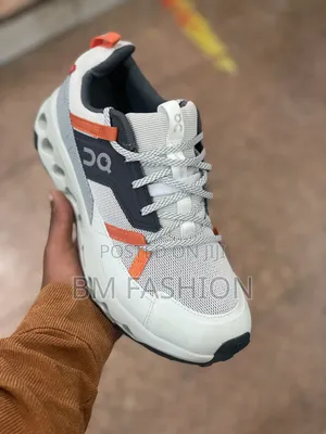 On Cloudsurfer Performance Sneakers: White/Orange Accents