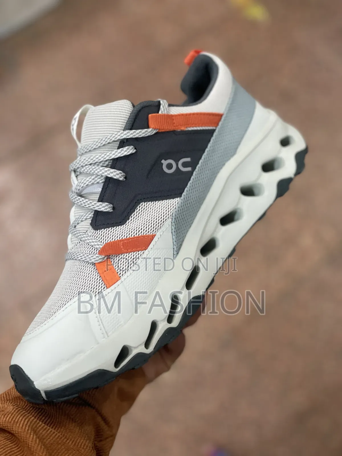 On Cloudsurfer Performance Sneakers: White/Orange Accents
