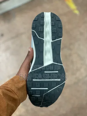 On Cloudsurfer Performance Sneakers: White/Orange Accents