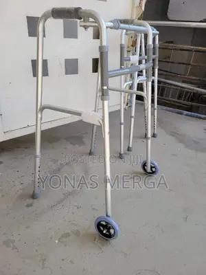 Walking Aid烙品walker With Two Rubber Stoppers and Two Rigid Castors.