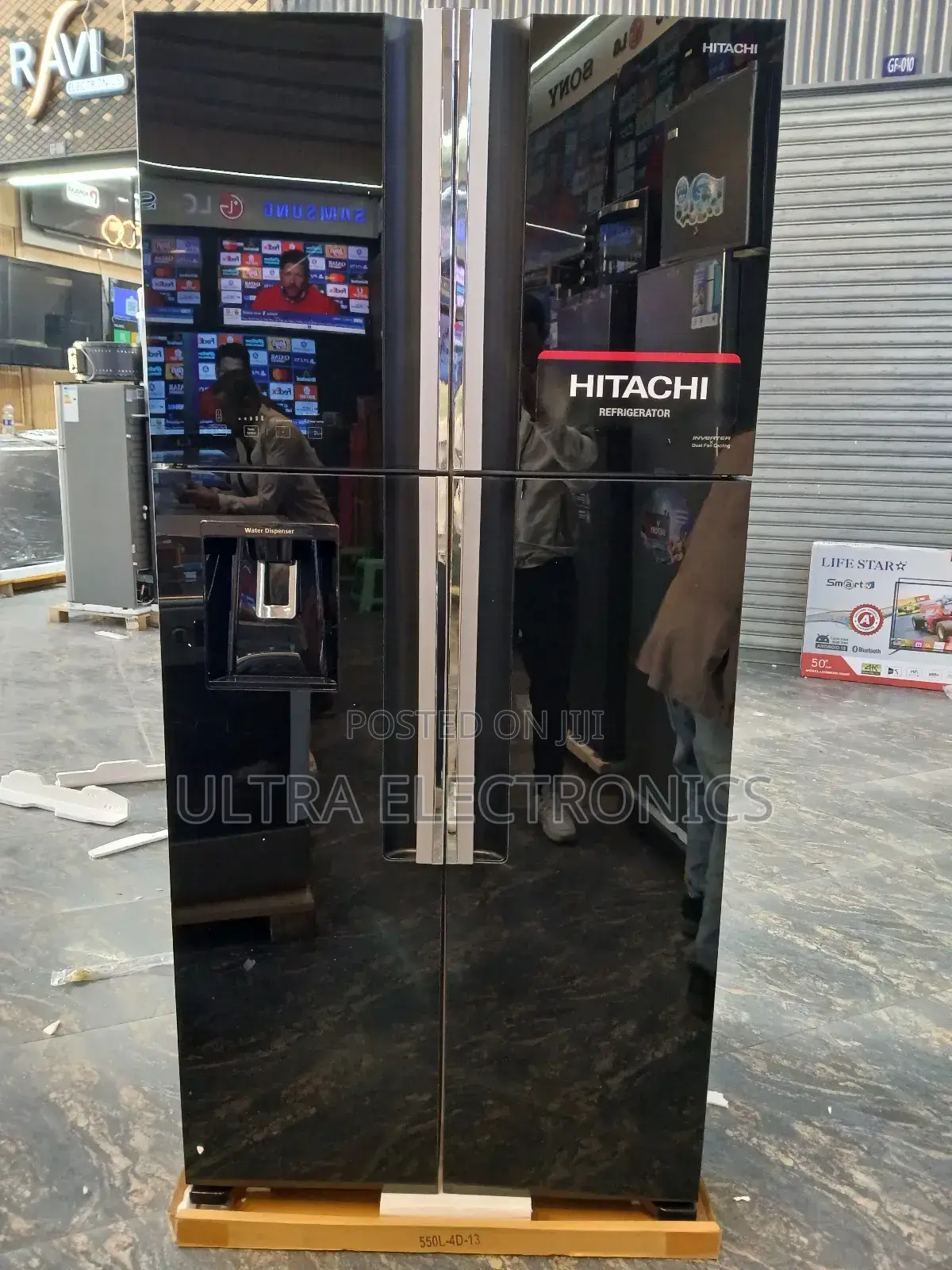Hitachi 4-Door French Door Refrigerator Featuring a Sleek Black Glass