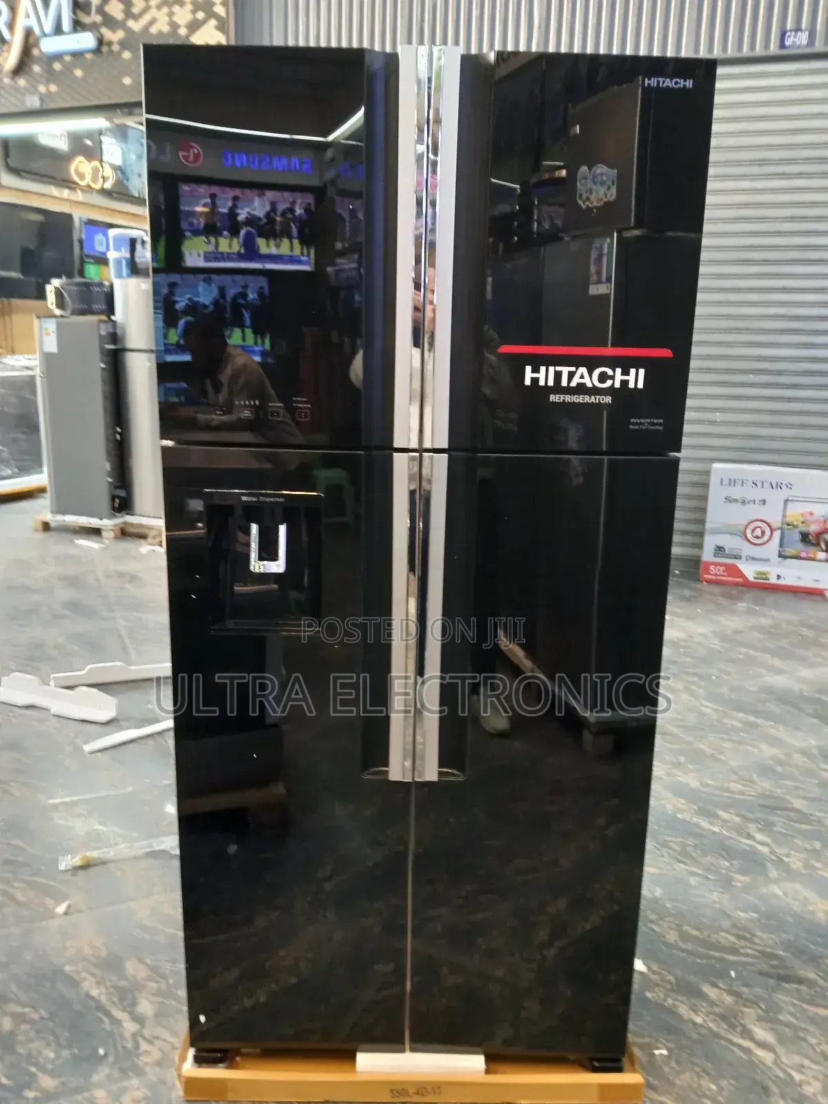 Hitachi 4-Door French Door Refrigerator Featuring a Sleek Black Glass