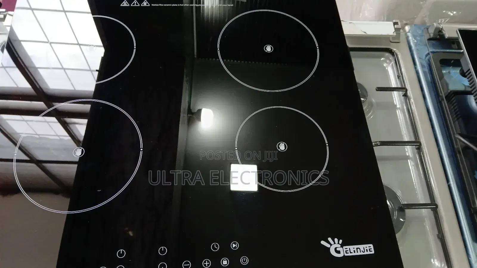 Stove Gelinjie Brand Induction Cooktop, Featuring a Sleek Black Glass