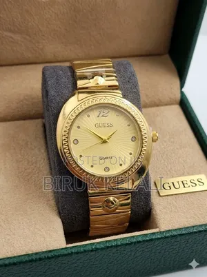 Guess Ladies' Gold-Tone Watch Features a Circular Champagne Dial