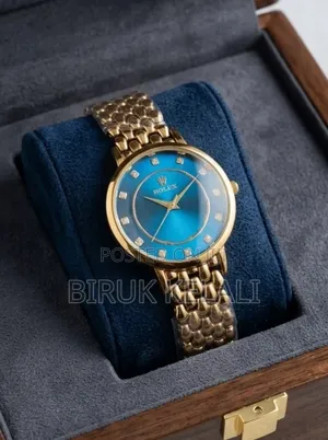 Gold-Toned Ladies' Watch Featuring a Blue Dial, Diamond Hour Markers