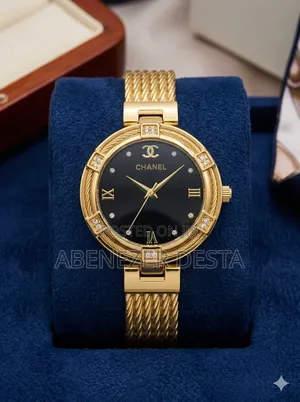 Gold-Toned Chanel Luxury Watch With a Black Dial and Diamond-Accented