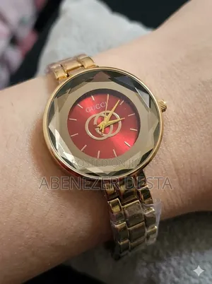 Gold-Tone Gucci Women's Watch Featuring a Distinct Red Dial