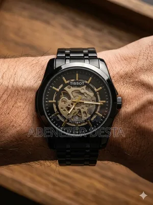 Tissot Automatic Skeleton Watch, Featured in a Black and Gold Color