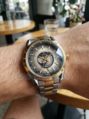 Tevise Wristwatch Features a Gold and Silver Stainless Steel Band And