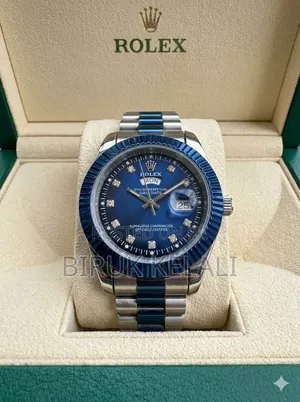Rolex Day-Date Wristwatch With a Blue Dial and Diamond Hour Markers.