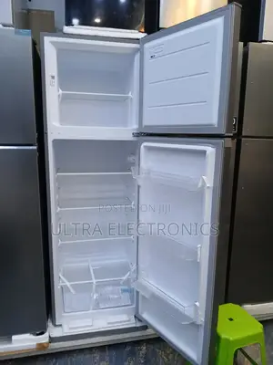 Midea Top-Freezer Refrigerator in a Silver Finish. The Unit Features