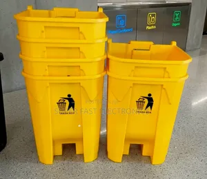Stacked Yellow Trash Bins and Recycling Station