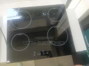 4 -Burner Electric Touch Stove With a Glass Surface.