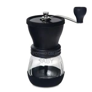 Manual Black Coffee Grinder With a Clear Glass Jar. [1, 2]