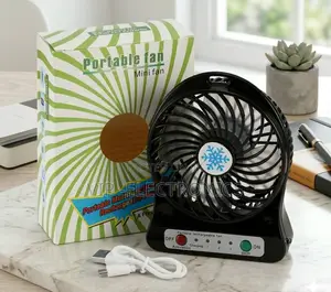 Portable Rechargeable Mini Desk Fan With Packaging and Accessories On