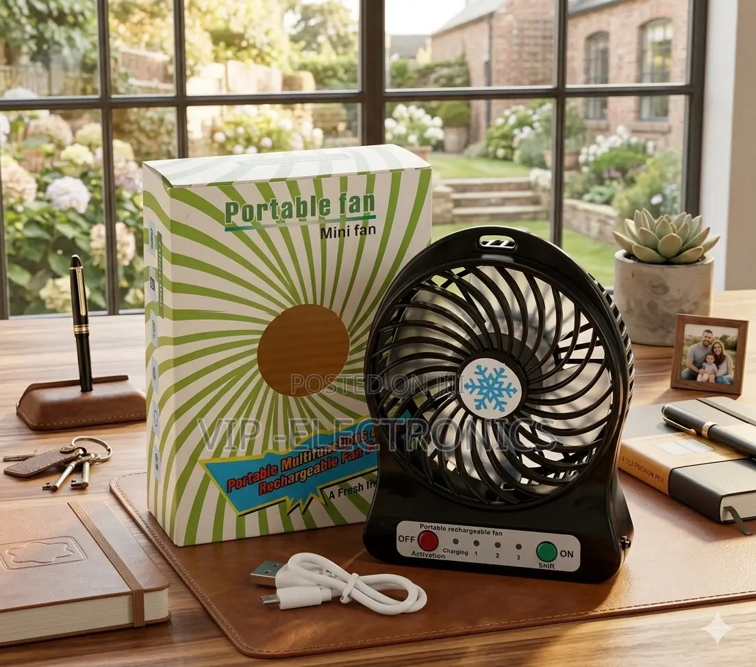 Portable Rechargeable Mini Desk Fan With Packaging and Accessories On