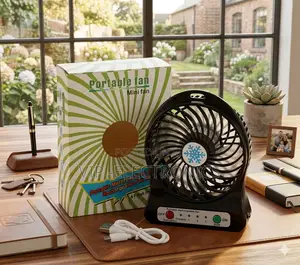 Portable Rechargeable Mini Desk Fan With Packaging and Accessories On