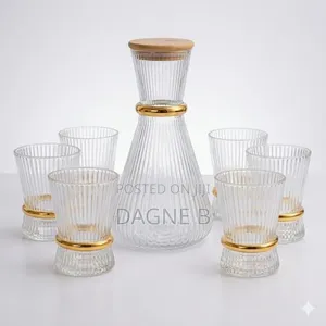 Ribbed Glass Carafe Set With a Gold-Accented Design ምጥጥ ማቅረቢያ ከነብርጭቆ