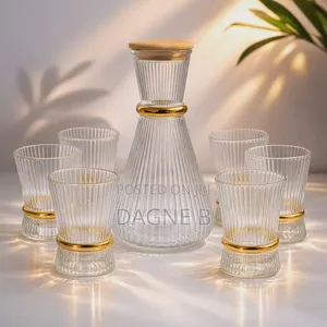 Ribbed Glass Carafe Set With a Gold-Accented Design ምጥጥ ማቅረቢያ ከነብርጭቆ