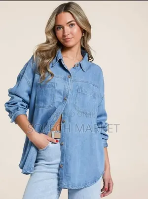 Light Blue Oversized Denim Shirt Features a Front Button Closure