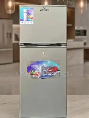 Victory Branded Silver Top-Freezer Refrigerator. It Is a Two