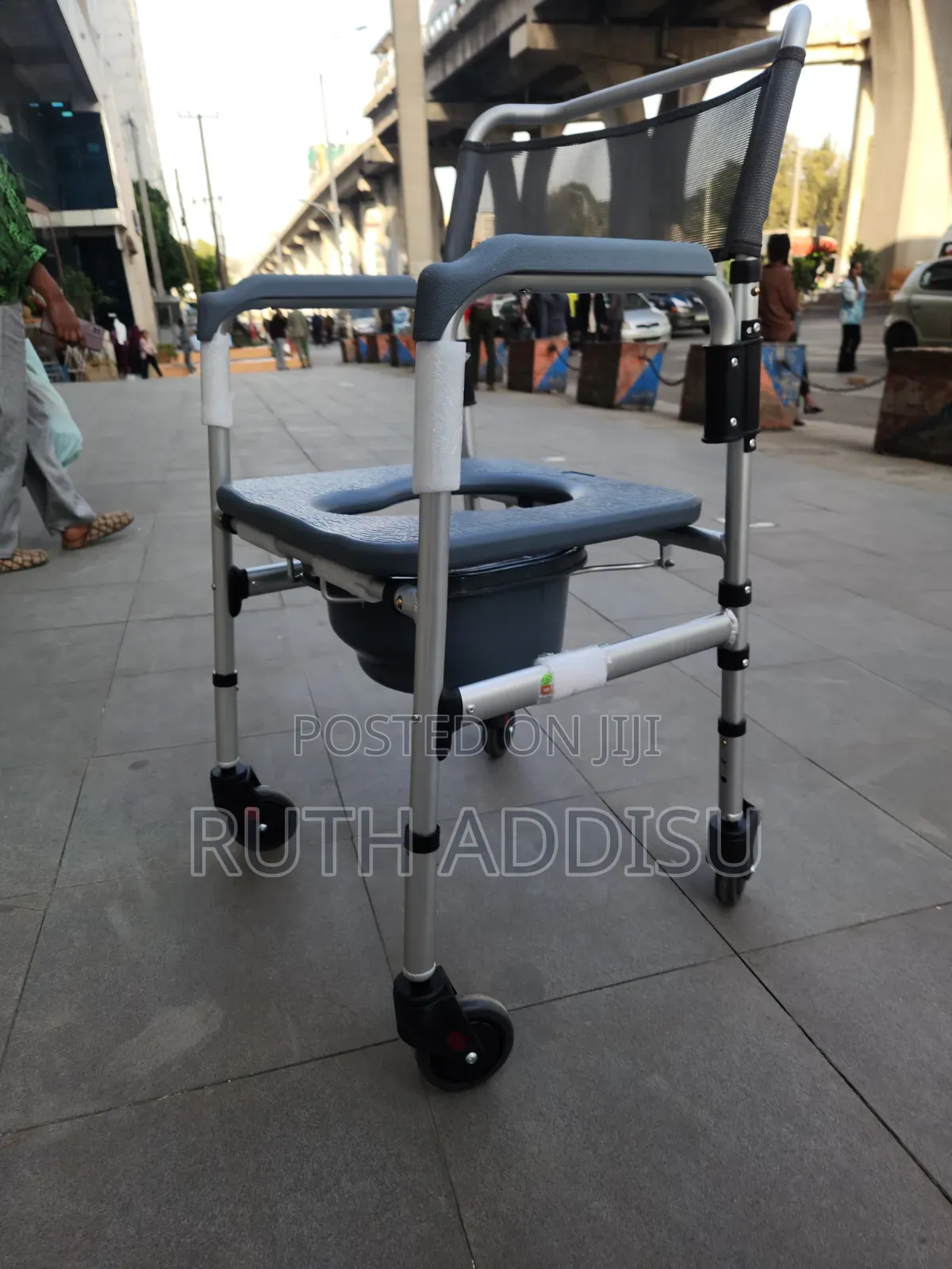 Portable Toilet Wheelchair Features a Foldable Stainless Steel Frame