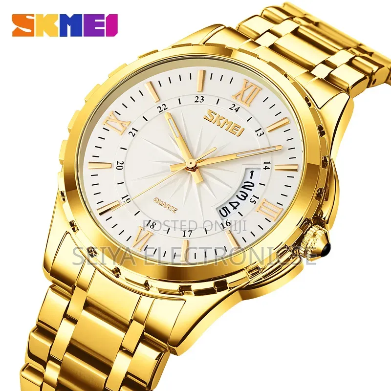 Skmei 9069 ♤ Features a Gold-Toned Stainless Steel ● Band
