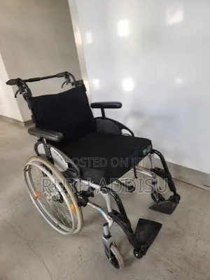 Foldable Manual Wheelchair Featuring a Black Seat and Silver Aluminum