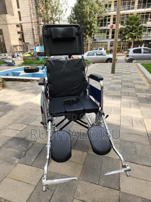 Wheelchair a Manual Reclining Commode Wheelchair Featuring a High