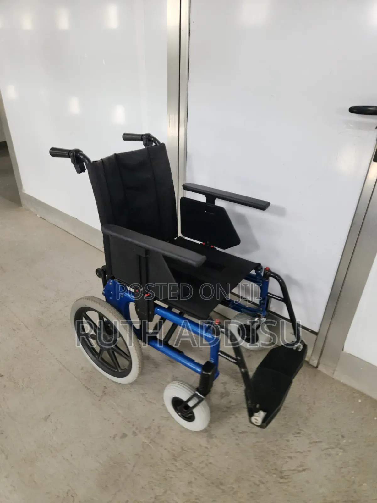 Portable, Manual Travel Wheelchair Featuring a Black, Red Wheelchair