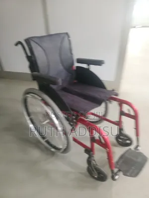 Lightweight, Red Foldable Manual Wheelchair Designed for Active Use