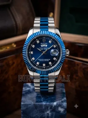 Rolex Watch Features a Distinct Fluted Bezel and a Silver Dial