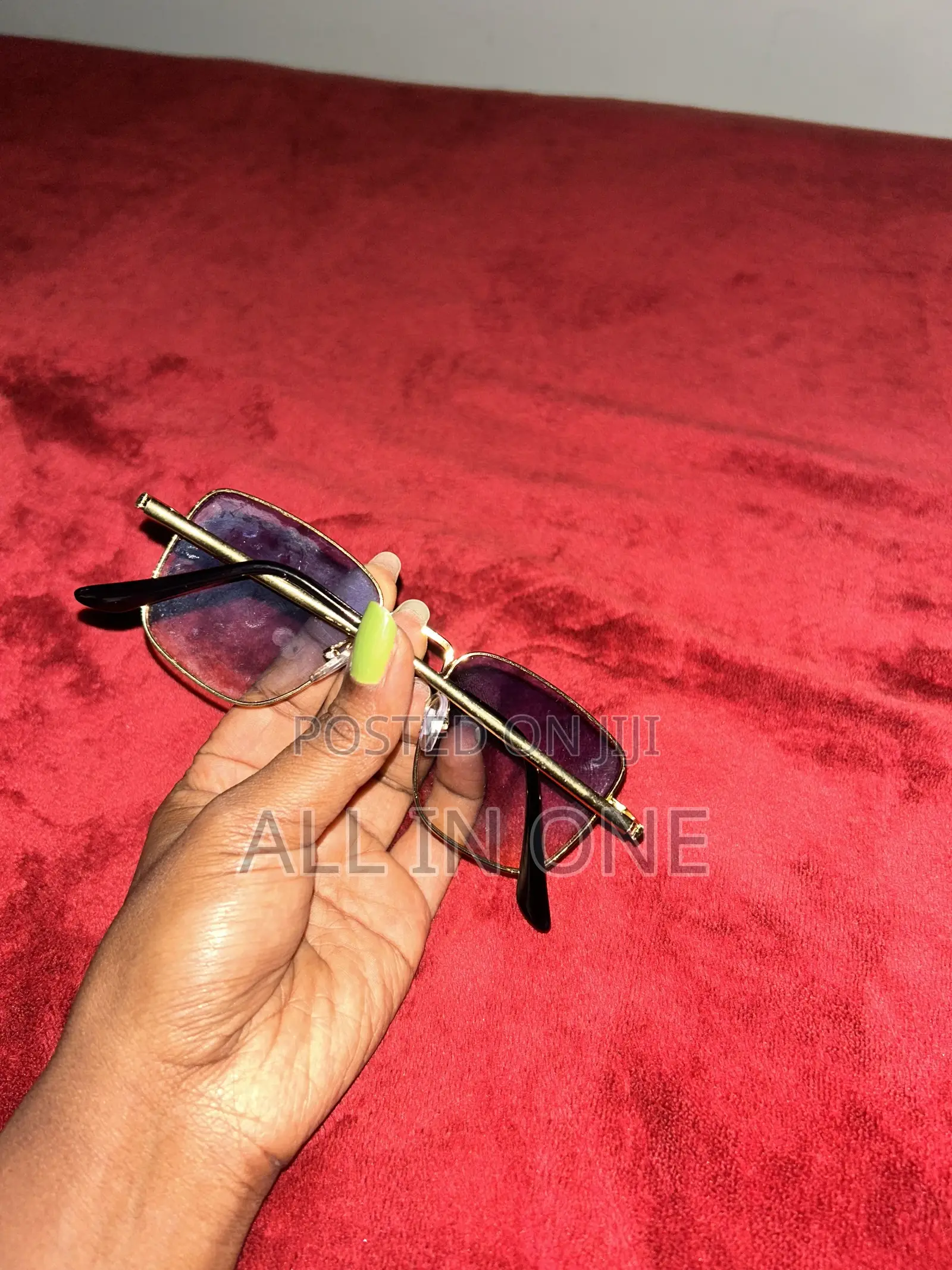 Gold Metal Frame and Purple Tinted Lenses.