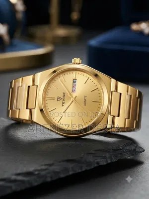 Tevise Watch Features a Prominent Gold- Tone Stainless Steel Band