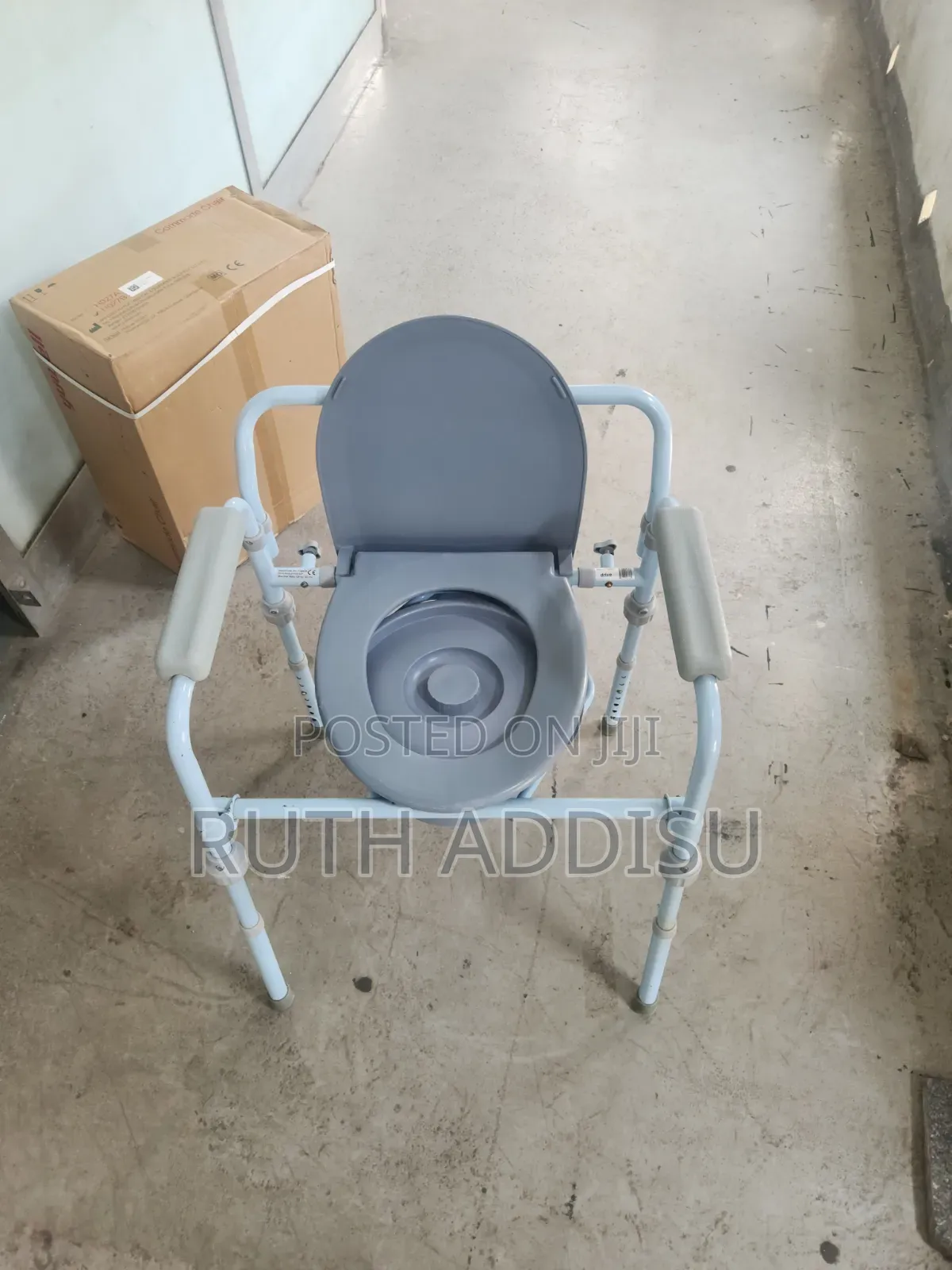 Portable Bedside Commode Chair Features a Light Blue Steel Frame With