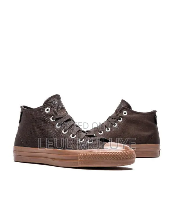 The Converse Chuck Taylor All Star Pro Mid in Velvet Brown
