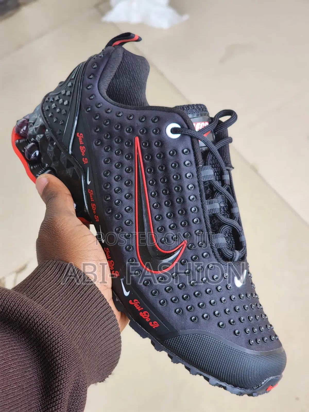 Black Nike Shox Model Featuring a "Just Do It"