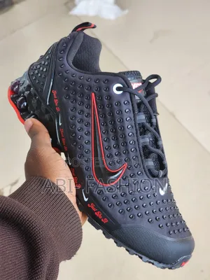 Black Nike Shox Model Featuring a "Just Do It"