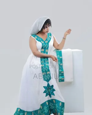 Elegant White Teal Habesha Kemis With Traditional Tibeb