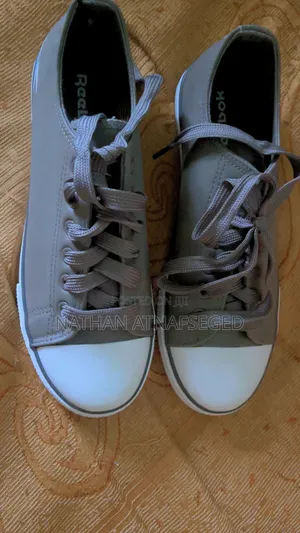 A Reebok Low Top Lace Up Sneaker