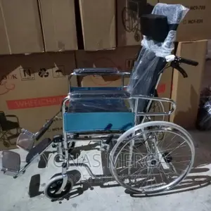 Wheelchair.-Adjustable Head Support Height and Angle: