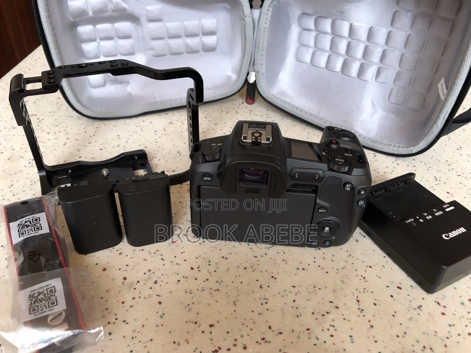 Canon R With Cage and Extras on Hand