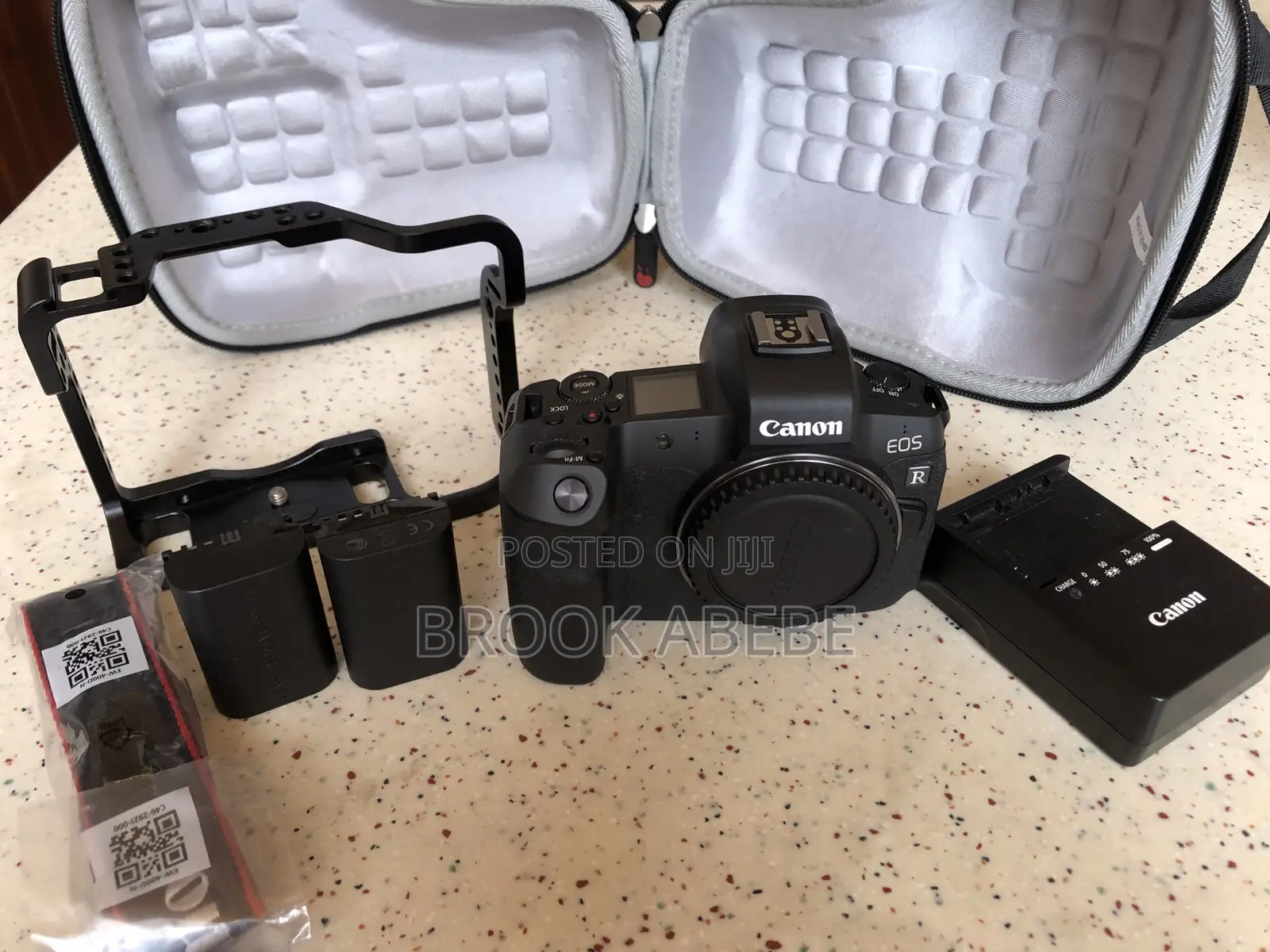 Canon R With Cage and Extras on Hand