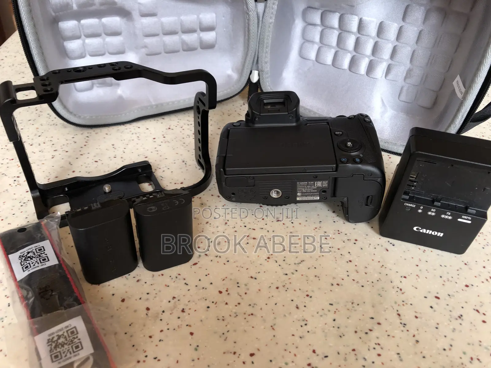 Canon R With Cage and Extras on Hand