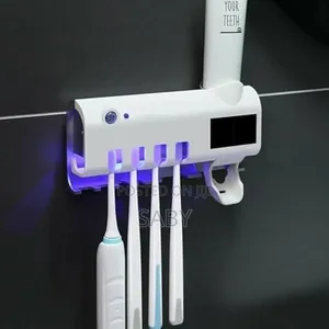 ግድግዳ ላይ የራሱ መለጠፊያ ያለው Toothbrush Sterilizer Dispenser